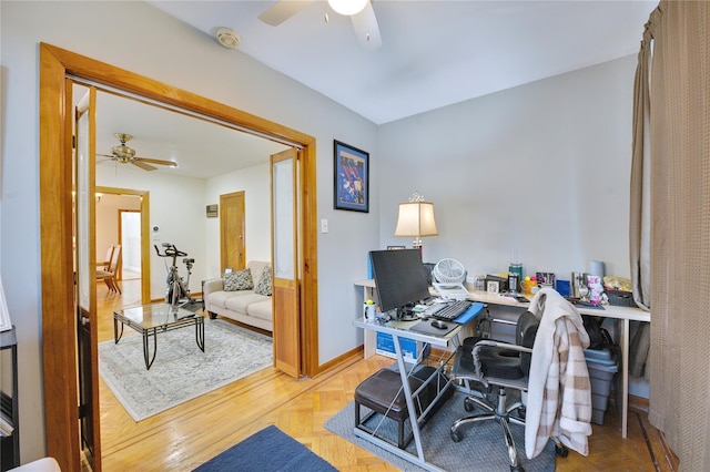 office featuring ceiling fan and baseboards