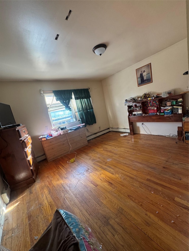 living room with a baseboard radiator and hardwood / wood-style floors