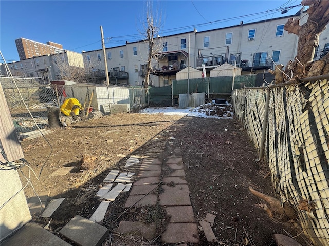 view of yard featuring a residential view and fence