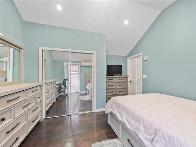 bedroom with lofted ceiling, dark wood-style floors, a closet, and recessed lighting