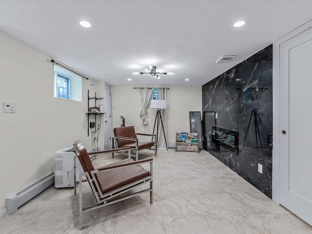 interior space with baseboard heating, visible vents, and recessed lighting