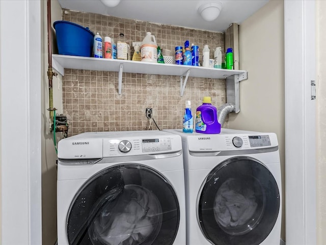 washroom featuring washer and clothes dryer