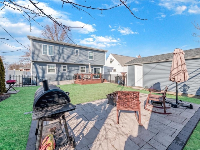 back of property with an outdoor fire pit, a lawn, a patio, a fenced backyard, and an outdoor structure