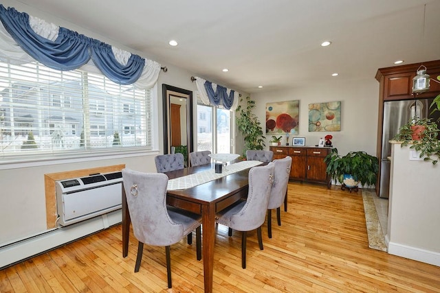 dining room with light wood-style flooring, recessed lighting, baseboards, a wall mounted AC, and baseboard heating