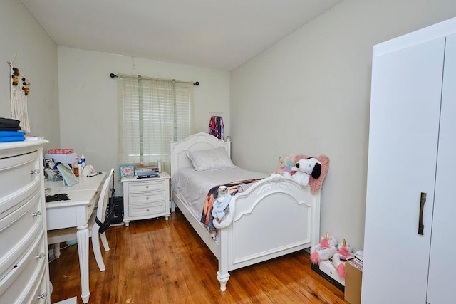 bedroom with wood finished floors