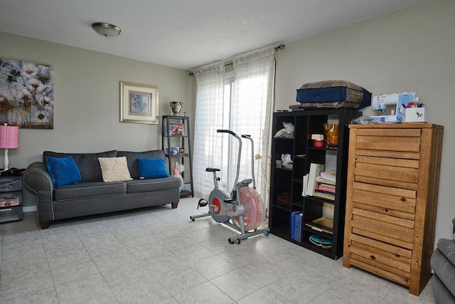 exercise area featuring tile patterned floors