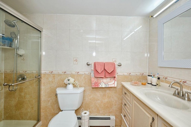 bathroom featuring a stall shower, tile walls, vanity, and a baseboard radiator