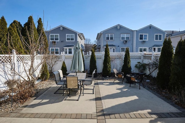 view of patio with fence private yard and outdoor dining area