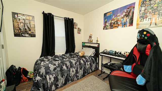 bedroom with wood finished floors