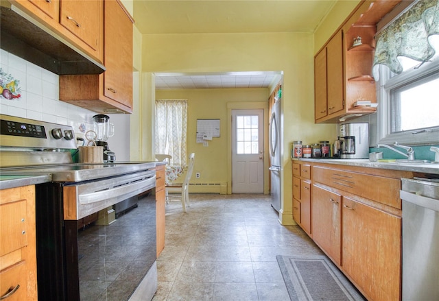 kitchen with tasteful backsplash, appliances with stainless steel finishes, under cabinet range hood, open shelves, and a sink