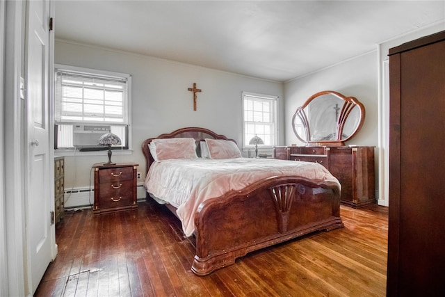 bedroom featuring a baseboard heating unit, cooling unit, wood-type flooring, and ornamental molding