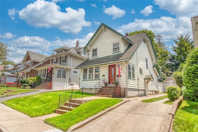 254 Rice Ave, Staten Island, NY 10314 - view of front of home with a shingled roof, entry steps, a front yard, and a chimney