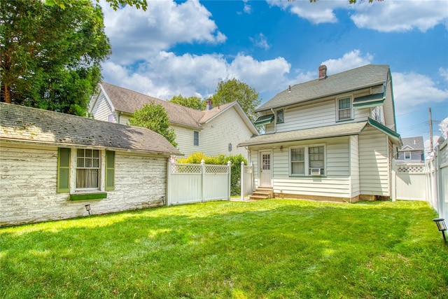 254 Rice Ave, Staten Island, NY 10314 - rear view of property featuring a fenced backyard, a chimney, entry steps, and cooling unit