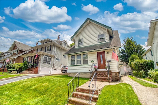 254 Rice Ave, Staten Island, NY 10314 - view of front of house featuring entry steps, an outbuilding, a front yard, and a shingled roof