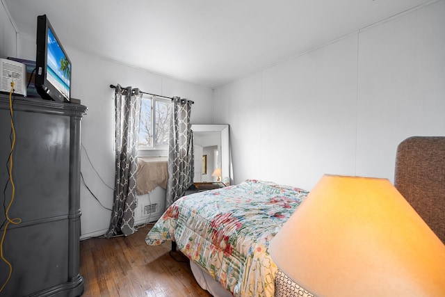 bedroom featuring hardwood / wood-style flooring