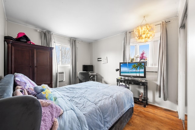 bedroom with wood finished floors