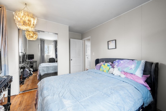 bedroom featuring a closet and light wood-style flooring