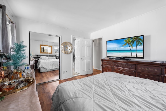 bedroom with a closet and wood finished floors