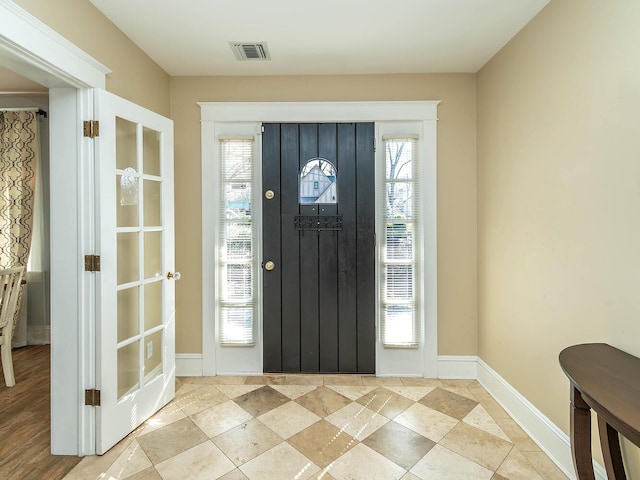 entrance foyer featuring visible vents and baseboards