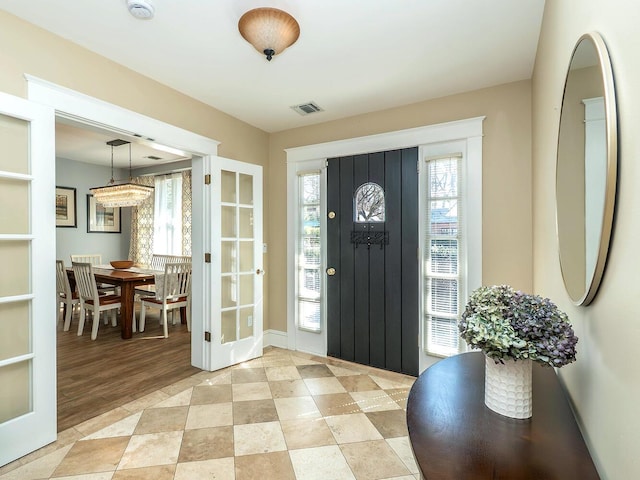 entryway featuring visible vents and french doors