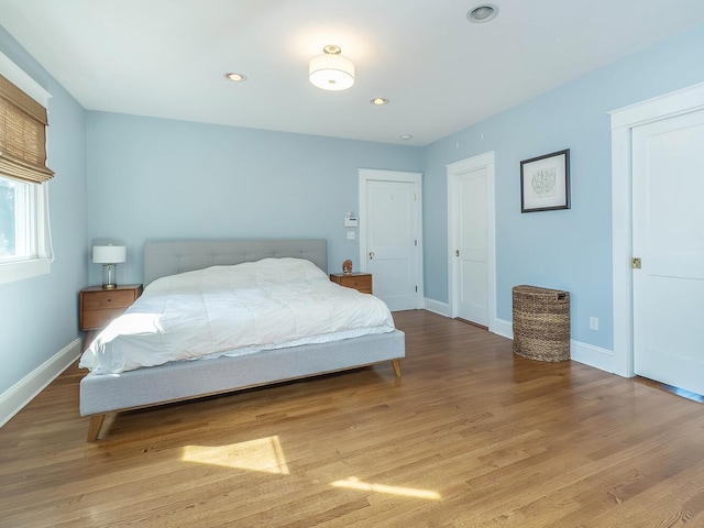 bedroom featuring recessed lighting, baseboards, and wood finished floors