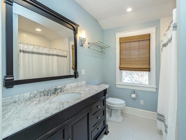 bathroom with recessed lighting, toilet, vanity, and baseboards