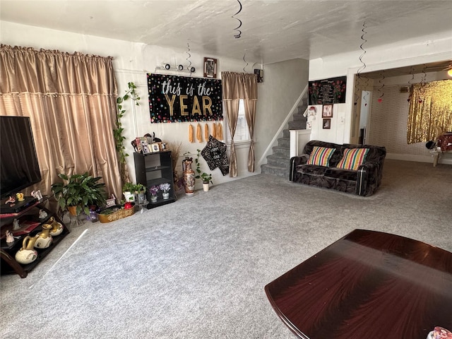 carpeted living room with stairway