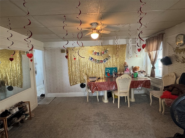 recreation room with wallpapered walls, ceiling fan, baseboards, and carpet flooring