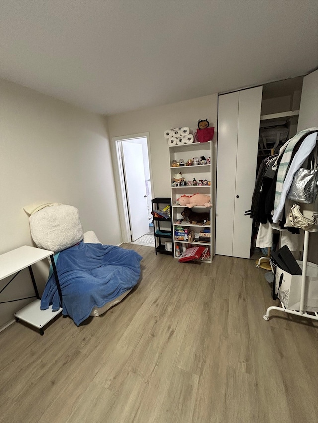 bedroom with wood finished floors