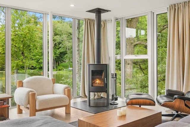 sunroom / solarium featuring a wood stove