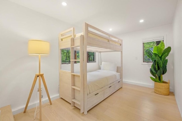 bedroom featuring baseboards, recessed lighting, and light wood-style floors