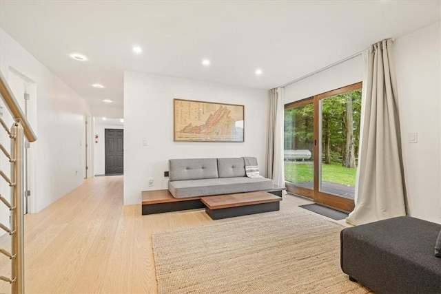 living room featuring stairway, wood finished floors, and recessed lighting