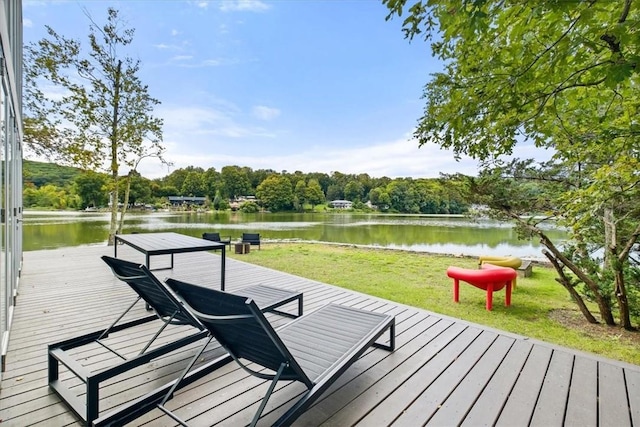 exterior space with a lawn and a water view