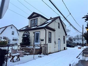 snow covered property featuring fence private yard