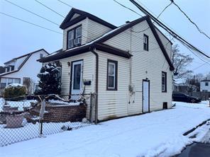 view of snowy exterior with fence