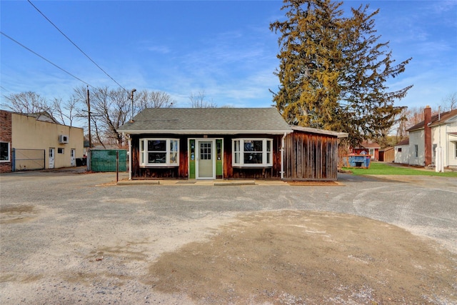 view of front of house with a shingled roof