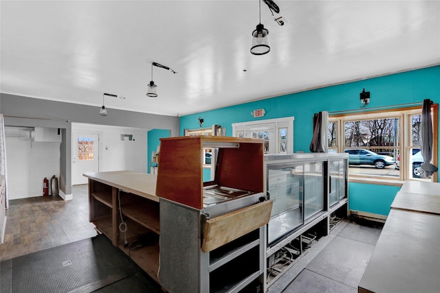 miscellaneous room with a healthy amount of sunlight and wood finished floors