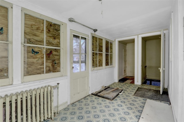 doorway to property with radiator heating unit