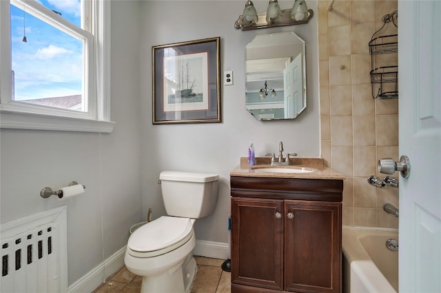 full bath with baseboards, radiator, toilet, tile patterned flooring, and vanity