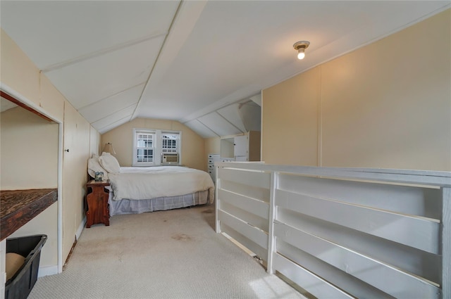 bedroom featuring lofted ceiling and carpet