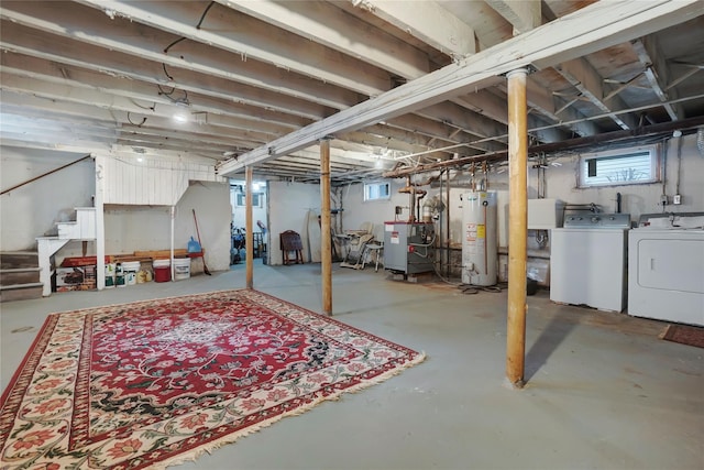 below grade area featuring gas water heater, a heating unit, independent washer and dryer, and stairs