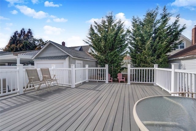 wooden terrace featuring fence