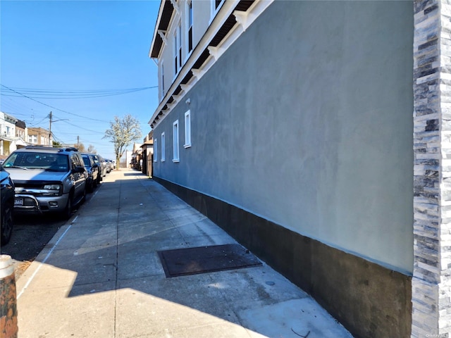 view of side of home featuring stucco siding