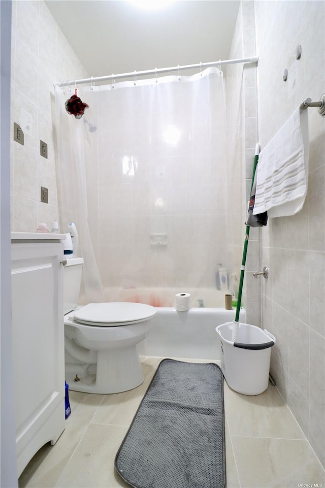 full bathroom with toilet, shower / bathtub combination with curtain, tile walls, and tile patterned floors