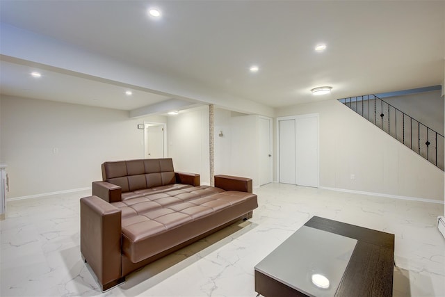 living room featuring marble finish floor, recessed lighting, and baseboards