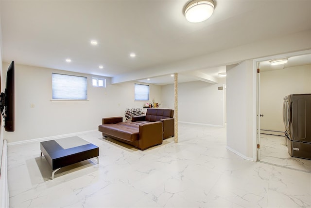 interior space featuring washer / dryer, baseboards, marble finish floor, baseboard heating, and recessed lighting