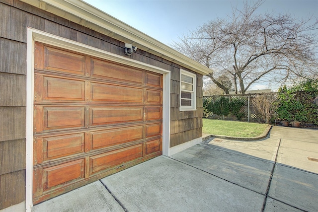 garage with fence