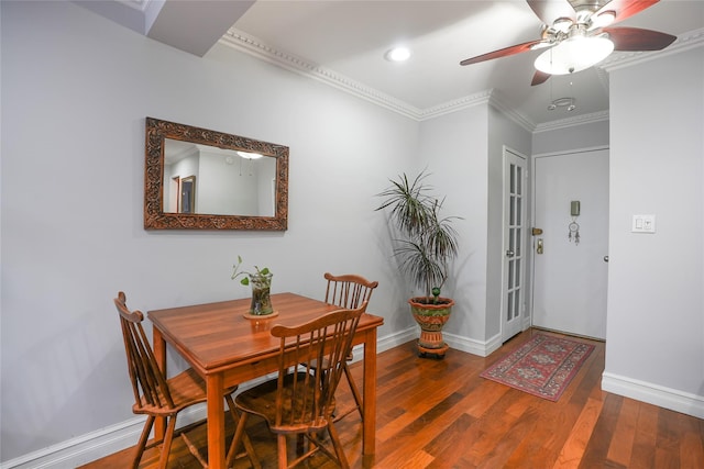 dining space with crown molding, recessed lighting, ceiling fan, wood finished floors, and baseboards