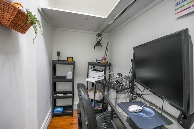 office area featuring baseboards and wood finished floors