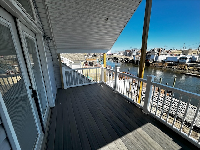 wooden terrace with a water view